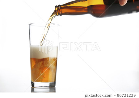Pouring beer white background looks delicious Pouring beer white background looks delicious 96721229