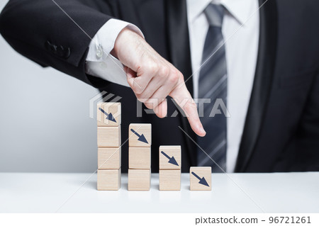 Wooden blocks with dark blue arrows icons, business decline loss drop concept 96721261