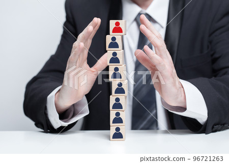 Wooden blocks with people icons and businessman hands, teamwork business concept Wooden blocks with people icons and businessman hands, teamwork business concept 96721263