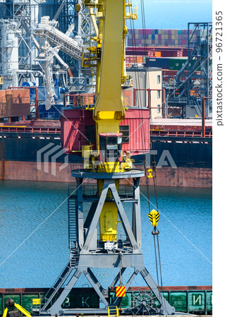 Odessa, Ukraine, May 4, 2019 - industrial seaport infrastructure, sea, cranes and dry cargo ship, grain silo, bulk carrier vessel and grain storage elevators, concept of sea cargo transportation Odessa, Ukraine, May 4, 2019 - industrial seaport infrastructure, sea, cranes and dry cargo ship, grain silo, bulk carrier vessel and grain storage elevators, concept of sea cargo transportation 96721365