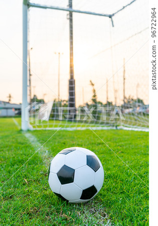 Soccer ball on the ball field 96722964
