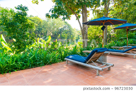 umbrella and pool bed around swimming pool umbrella and pool bed around swimming pool 96723030