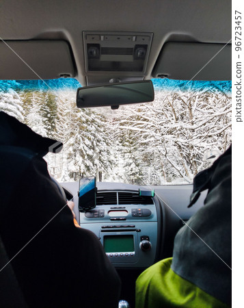 view from inside car dashboard steering car by snowed road 96723457