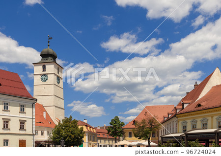 The Jesuit church is a very large building with a bell tower in square, Sibiu, Romania 96724024