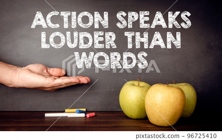 Action Speaks Louder Than Words Concept. Teacher's desk Action Speaks Louder Than Words Concept. Teacher's desk 96725410