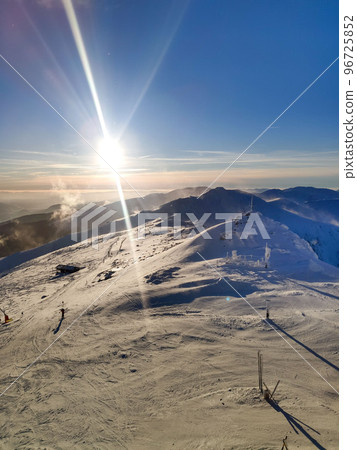 sunset above ski slope in Slovakia tatra mountains 96725852