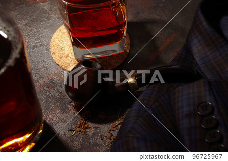 Concept of relaxation with smoking tobacco with smoking pipe and drinking alcohol 96725967