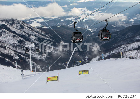 Slovakia, Jasna - February 3, 2022: chair lift cabin ski resort Slovakia, Jasna - February 3, 2022: chair lift cabin ski resort 96726234