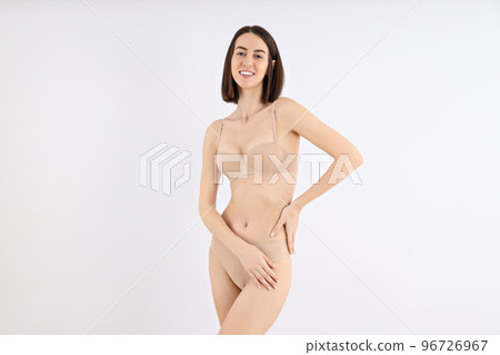Concept of weight loss with slim young woman on light background 96726967