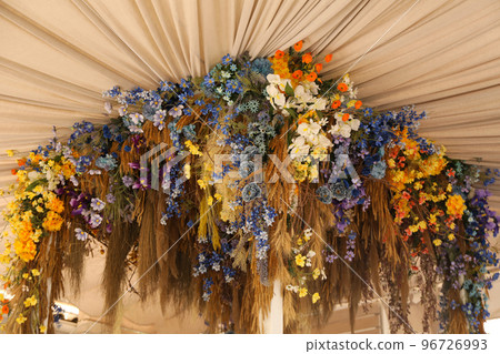 Different flowers as decor of restaurant in sunny day Different flowers as decor of restaurant in sunny day 96726993