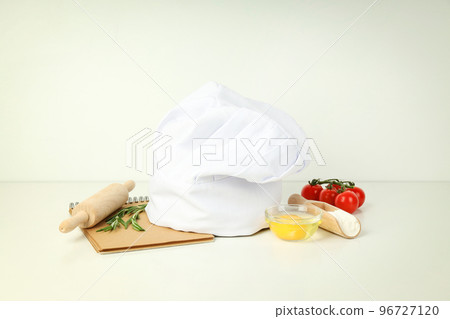 Concept of cooking food with chef hat Concept of cooking food with chef hat 96727120