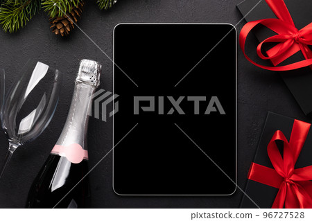 Tablet with blank screen and Christmas decor Tablet with blank screen and Christmas decor 96727528