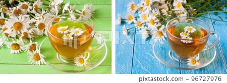 Herbal tea with fresh chamomile flowers on green wooden background 96727976