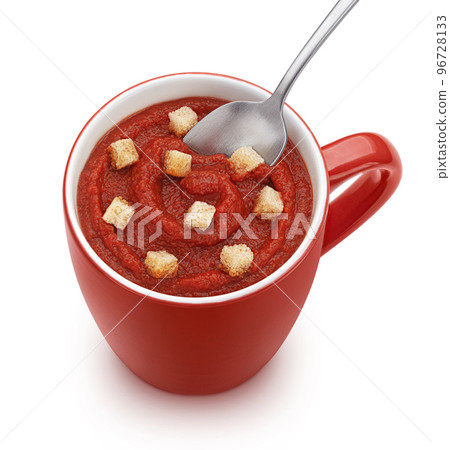 Instant tomato soup with croutons in red mug isolated, top view Instant tomato soup with croutons in red mug isolated, top view 96728133