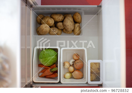 Storing vegetables in the kitchen. Storing vegetables in the kitchen. 96728832