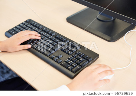 Junior high school students studying computer programming Junior high school students studying computer programming 96729659