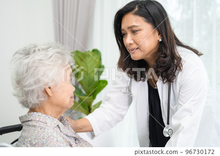 Doctor help and care Asian senior or elderly old lady woman patient sitting on wheelchair at nursing hospital ward, healthy strong medical concept 96730172