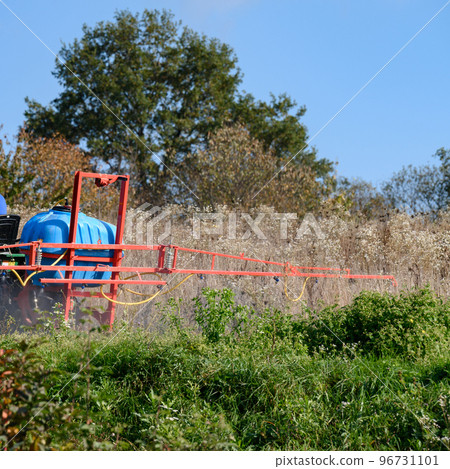 Treatment of the field with herbicides against pests and weeds. 96731101