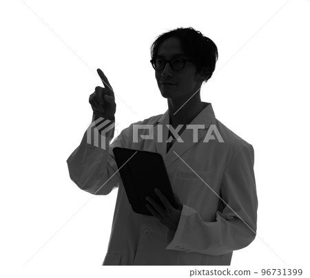 Silhouette of a man in a white coat using a tablet Silhouette of a man in a white coat using a tablet 96731399