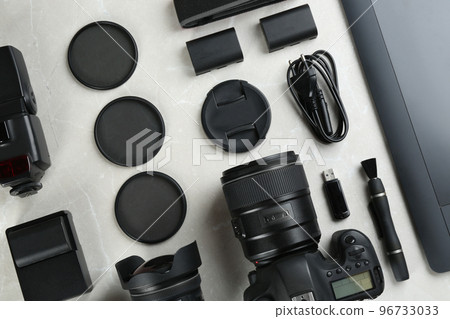 Flat lay composition with equipment for professional photographer on grey marble table 96733033