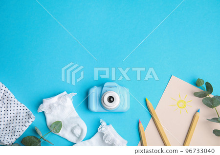 Flat lay composition with toy camera on light blue background, space for text. Future photographer Flat lay composition with toy camera on light blue background, space for text. Future photographer 96733040