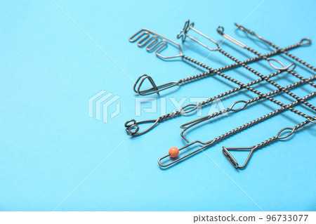 Set of logopedic probes for speech therapy on light blue background 96733077