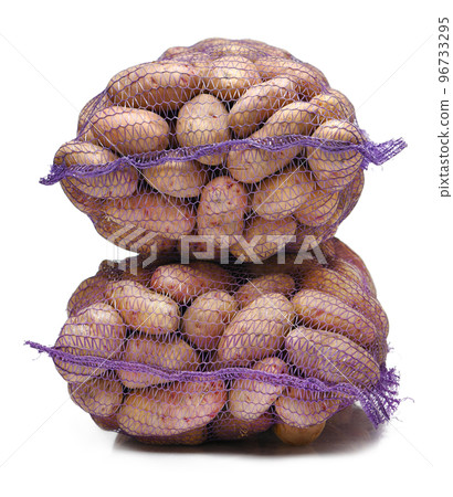 two bags of potatoes, objects isolated on a white background two bags of potatoes, objects isolated on a white background 96733295
