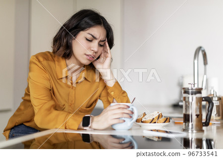 Depression Concept. Upset Arab Woman Sitting At Kitchen Counter At Home 96733541