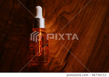 Organic oil serum bottle on natural wooden background with copyspace, beauty and skincare product. 96736112