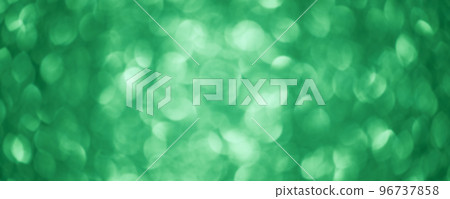 Green glitter background defocus light. Round defocuses on a blurred background. 96737858