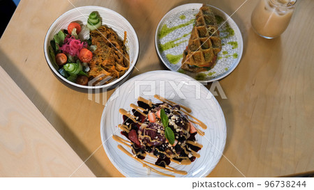 Vegan dishes on the table at a restaurant or cafeteria 96738244