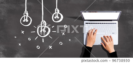 Hanging idea light bulbs with laptop computer Hanging idea light bulbs with laptop computer 96738930