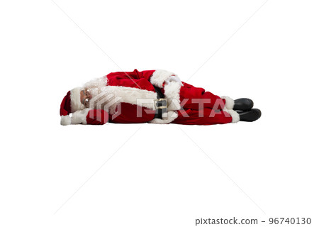Santa claus is tired and sleeps from exhaustion Santa claus is tired and sleeps from exhaustion 96740130