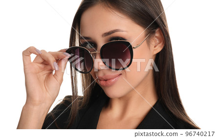 Beautiful young woman wearing sunglasses on white background, closeup Beautiful young woman wearing sunglasses on white background, closeup 96740217