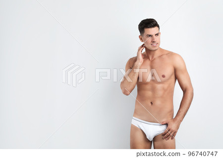 Handsome man in underwear on white background. Space for text Handsome man in underwear on white background. Space for text 96740747