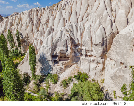 Beautiful stunning view of the mountains of Cappadocia and cave houses. Turkey Beautiful stunning view of the mountains of Cappadocia and cave houses. Turkey 96741864