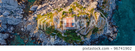 BANNER, LONG FORMAT Sveta Nedelja is an islet on the Adriatic Sea, in Montenegrin municipality of Budva. It is located opposite the town of Petrovac na Moru in Montenegro. It has a small church on it 96741902