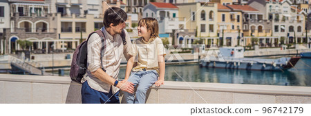BANNER, LONG FORMAT Father and son tourists enjoying the views of Architecture and luxury yachts in Lustica Bay, Montenegro. Travel around Montenegro concept. Go Everywhere 96742179