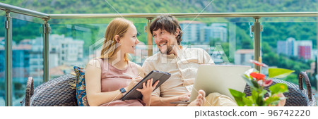 Man and woman working on the terrace, remote work concept BANNER, LONG FORMAT 96742220