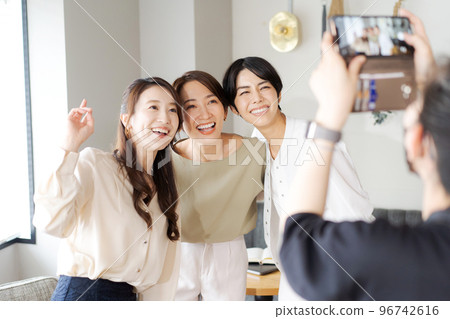 women taking pictures 96742616