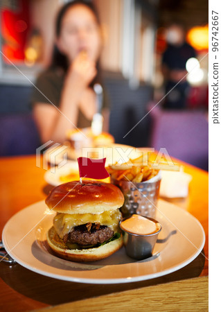 Hamburger, french fries and sauce on a plate. High quality photo Hamburger, french fries and sauce on a plate. High quality photo 96742667