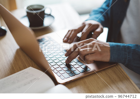 Hands of men using a personal computer Hands of men using a personal computer 96744712