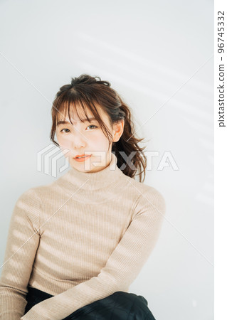 woman wearing turtleneck knit woman wearing turtleneck knit 96745332