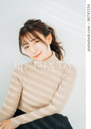 woman wearing turtleneck knit woman wearing turtleneck knit 96745334