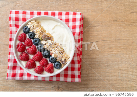 homemade yogurt bowl with raspberry, blueberry and granola homemade yogurt bowl with raspberry, blueberry and granola 96745596