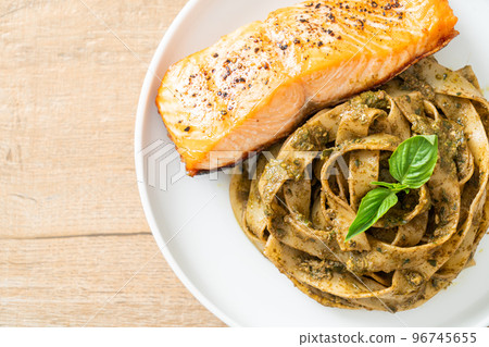 pesto fettuccine spaghetti pasta with grilled salmon fillet pesto fettuccine spaghetti pasta with grilled salmon fillet 96745655