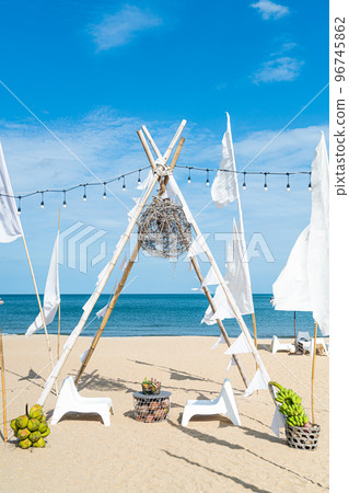 patio outdoor table and chair on beach with sea beach background 96745862