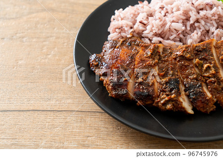spicy grilled Jamaican jerk chicken with rice spicy grilled Jamaican jerk chicken with rice 96745976