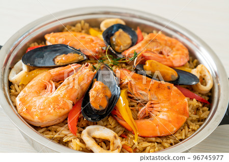 Seafood Paella with prawns, clams, mussels on saffron rice Seafood Paella with prawns, clams, mussels on saffron rice 96745977