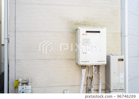 Deteriorated water heater and dirty outer wall of the house 96746289